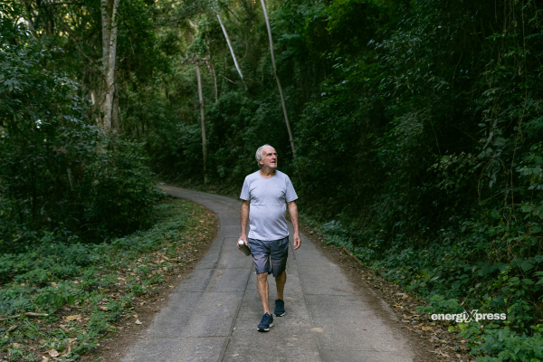 A man walking outdoors or engaging in light activity