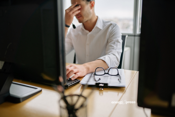 A man working while sitting for long periods in front of a computer